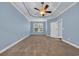 Spacious bedroom with soft carpet, ceiling fan, and a bright window view at 760 Carolina Farms Blvd., Myrtle Beach, SC 29579