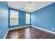 Bedroom with hardwood floors, neutral paint, and natural light from two windows at 760 Carolina Farms Blvd., Myrtle Beach, SC 29579
