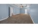 Spacious bedroom with neutral carpeting, ceiling fan, and access to the ensuite bathroom and hallway at 760 Carolina Farms Blvd., Myrtle Beach, SC 29579