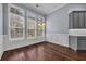 Sunlit dining area featuring hardwood floors and three large windows at 760 Carolina Farms Blvd., Myrtle Beach, SC 29579