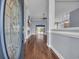 Inviting foyer featuring a decorative glass front door, hardwood floors, and a view into the spacious living areas at 760 Carolina Farms Blvd., Myrtle Beach, SC 29579