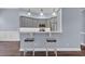 Kitchen featuring a breakfast bar with seating, grey cabinets, and stainless appliances at 760 Carolina Farms Blvd., Myrtle Beach, SC 29579