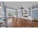 Bright living area with hardwood floors, a cozy fireplace, built-in shelves, and a stylish breakfast bar at 760 Carolina Farms Blvd., Myrtle Beach, SC 29579