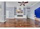 Comfortable living space featuring hardwood floors, a modern fireplace, and a ceiling fan for added comfort at 760 Carolina Farms Blvd., Myrtle Beach, SC 29579