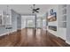 Open living space with hardwood floors, a modern fireplace, built-in cabinetry, and stylish architectural details at 760 Carolina Farms Blvd., Myrtle Beach, SC 29579