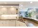Bright and airy kitchen boasts modern appliances, a breakfast bar, and seamless access to the dining and living areas at 786 Wild Oak Ln. Nw, Calabash, NC 28467