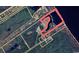 Property outline on overhead view with surrounding land and nearby pond at 951 Herriott Farms Dr., Georgetown, SC 29440