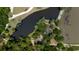 Stunning aerial shot of a home nestled beside a serene pond surrounded by lush greenery at 951 Herriott Farms Dr., Georgetown, SC 29440