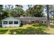 Exterior showcasing an enclosed sunroom and brick architecture at 951 Herriott Farms Dr., Georgetown, SC 29440