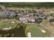 Aerial view of a golf course community, featuring lush fairways, ponds, and luxury homes at 9737 Catalonia Ct., Myrtle Beach, SC 29579