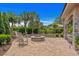 Serene backyard featuring a stone fire pit and a cozy seating area at 9737 Catalonia Ct., Myrtle Beach, SC 29579