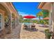 Luxurious backyard with a private pool, covered patio, and elegant stone pillars at 9737 Catalonia Ct., Myrtle Beach, SC 29579