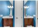 Bathroom featuring dual sinks with wood cabinets, granite countertops, and decorative lighting at 9737 Catalonia Ct., Myrtle Beach, SC 29579
