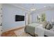 Bright bedroom with soft blue walls, decorative lighting and neutral toned decor at 9737 Catalonia Ct., Myrtle Beach, SC 29579