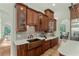 Close-up of a kitchen with a copper sink, tile backsplash, and wooden cabinets at 9737 Catalonia Ct., Myrtle Beach, SC 29579