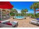 A beautiful pool featuring a waterfall feature and tropical landscaping with seating areas at 9737 Catalonia Ct., Myrtle Beach, SC 29579