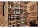 Wine cellar featuring custom wood racking to display an extensive wine collection at 9737 Catalonia Ct., Myrtle Beach, SC 29579