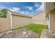 Cozy backyard featuring a grassy area and concrete and stone patio at 100 St. Andrews Ln., Myrtle Beach, SC 29588