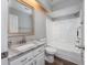 Well-lit bathroom featuring a marble-topped vanity, a standard toilet, and shower-tub combo at 100 St. Andrews Ln., Myrtle Beach, SC 29588