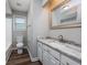 Updated bathroom featuring a granite vanity top, stylish faucet, and wood look flooring at 100 St. Andrews Ln., Myrtle Beach, SC 29588