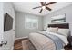 Nicely decorated bedroom features a comfortable bed, wall-mounted TV, and wood flooring at 100 St. Andrews Ln., Myrtle Beach, SC 29588