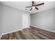 Bedroom with wood floors, ceiling fan, large closet, and neutral walls for a versatile space at 100 St. Andrews Ln., Myrtle Beach, SC 29588