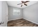 Unfurnished bedroom with natural light, ceiling fan, and wood-look flooring at 100 St. Andrews Ln., Myrtle Beach, SC 29588