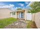 Exterior view of home, with a grassy backyard and stone pathway at 100 St. Andrews Ln., Myrtle Beach, SC 29588