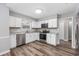 This modern kitchen features white cabinets, stainless steel appliances, and marble-look countertops at 100 St. Andrews Ln., Myrtle Beach, SC 29588