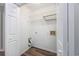 Compact laundry room featuring white wire shelving and wood look flooring at 100 St. Andrews Ln., Myrtle Beach, SC 29588