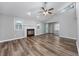 Spacious living room featuring a fireplace, vaulted ceiling, and beautiful hardwood floors at 100 St. Andrews Ln., Myrtle Beach, SC 29588