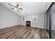 Spacious living room featuring a fireplace, vaulted ceiling, and beautiful hardwood floors at 100 St. Andrews Ln., Myrtle Beach, SC 29588