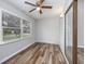 Cozy sunroom with hardwood floors, large windows, and a ceiling fan at 100 St. Andrews Ln., Myrtle Beach, SC 29588