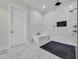 Modern bathroom features a freestanding tub, walk-in shower with sleek fixtures and tiled accent wall at 1024 Pochard Dr., Conway, SC 29526