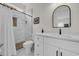 Updated bathroom featuring white vanity, walk-in shower with glass door, and stylish fixtures at 1024 Pochard Dr., Conway, SC 29526