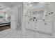 Stylish bathroom with double vanity, modern fixtures, marble floors, and walk-in shower with glass door at 1024 Pochard Dr., Conway, SC 29526