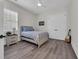 Cozy bedroom featuring a comfortable bed, neutral tones, window with blinds, and closet doors at 1024 Pochard Dr., Conway, SC 29526