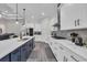 Modern kitchen with stainless steel appliances, white cabinetry, a large island, and eat-in breakfast bar at 1024 Pochard Dr., Conway, SC 29526
