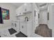 Well-equipped laundry room with white cabinetry, a sink, washer, dryer, and stylish tile flooring at 1024 Pochard Dr., Conway, SC 29526
