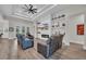 Bright living room with modern fireplace, floating shelves, coffered ceiling, and comfortable seating at 1024 Pochard Dr., Conway, SC 29526