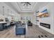 Spacious living room with a modern fireplace, built-in shelves, and an open layout to the kitchen at 1024 Pochard Dr., Conway, SC 29526