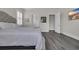 Comfortable main bedroom with a plush bed, view of ensuite bathroom, and neutral decor at 1024 Pochard Dr., Conway, SC 29526