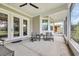 Inviting screened patio with ceiling fan and outdoor seating perfect for enjoying the fresh air at 1024 Pochard Dr., Conway, SC 29526