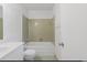 A compact bathroom features a shower-tub combination, tiled walls, and standard fixtures at 1025 Carolina Rd. # H4, Conway, SC 29526