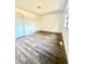 A bright bedroom with wood-look floors and natural light from the window at 1025 Carolina Rd. # H4, Conway, SC 29526