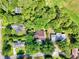 Aerial view of a property surrounded by mature trees in a residential area at 103 Wofford Ln., Conway, SC 29526