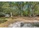 Large, private backyard with mature trees and a storage shed at 103 Wofford Ln., Conway, SC 29526