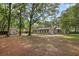 Spacious backyard with mature trees and a partial view of the house at 103 Wofford Ln., Conway, SC 29526