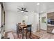 Cozy dining area featuring a dark wood table, decorative rug, and ample natural light from nearby windows at 103 Wofford Ln., Conway, SC 29526