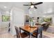 Cozy dining area next to a kitchen, features dark wood table and chairs with a decorative rug at 103 Wofford Ln., Conway, SC 29526